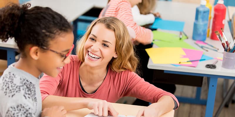 Mentor and student working together on a creative project